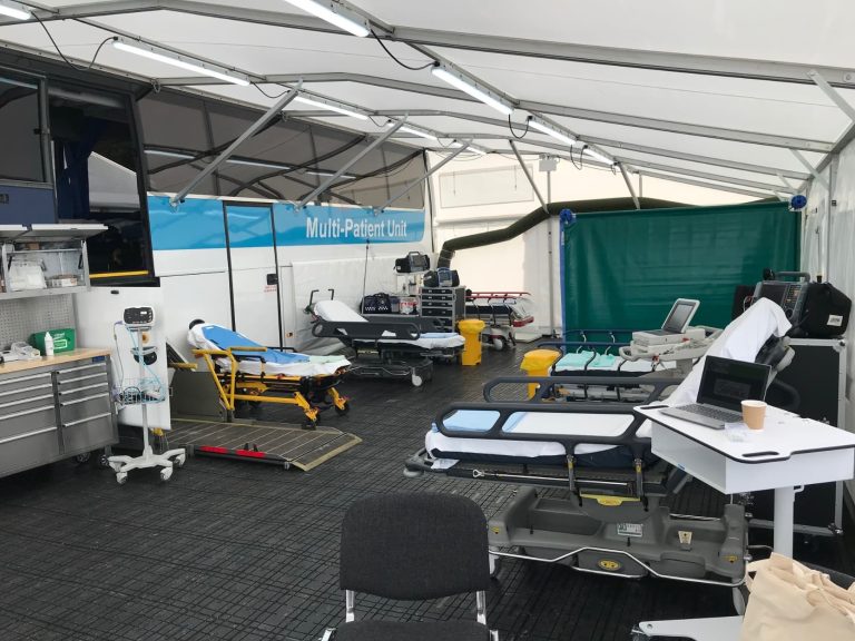 Emergency medical equipment set up under awning